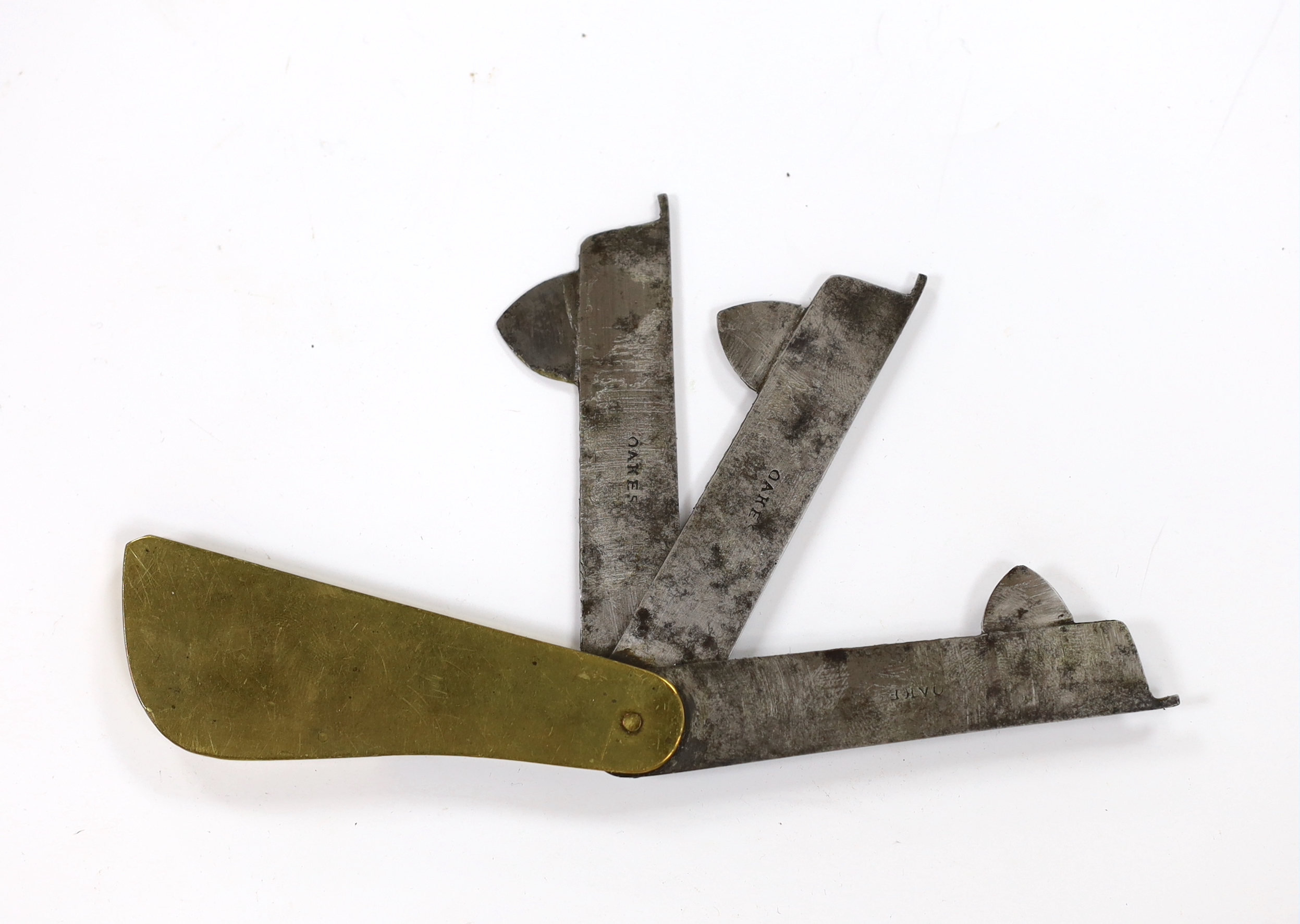 A brass and steel fleam, dated Sep 10th 1833, inscribed E Wright, 8.5cm folded